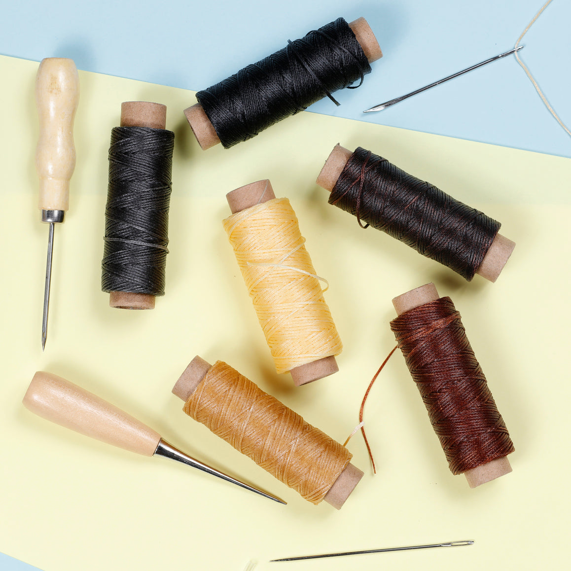 Image of Assorted Leather Sewing Threads and Tools Close-up | Caption-Assorted Leather Sewing Threads and Tools Close-up
