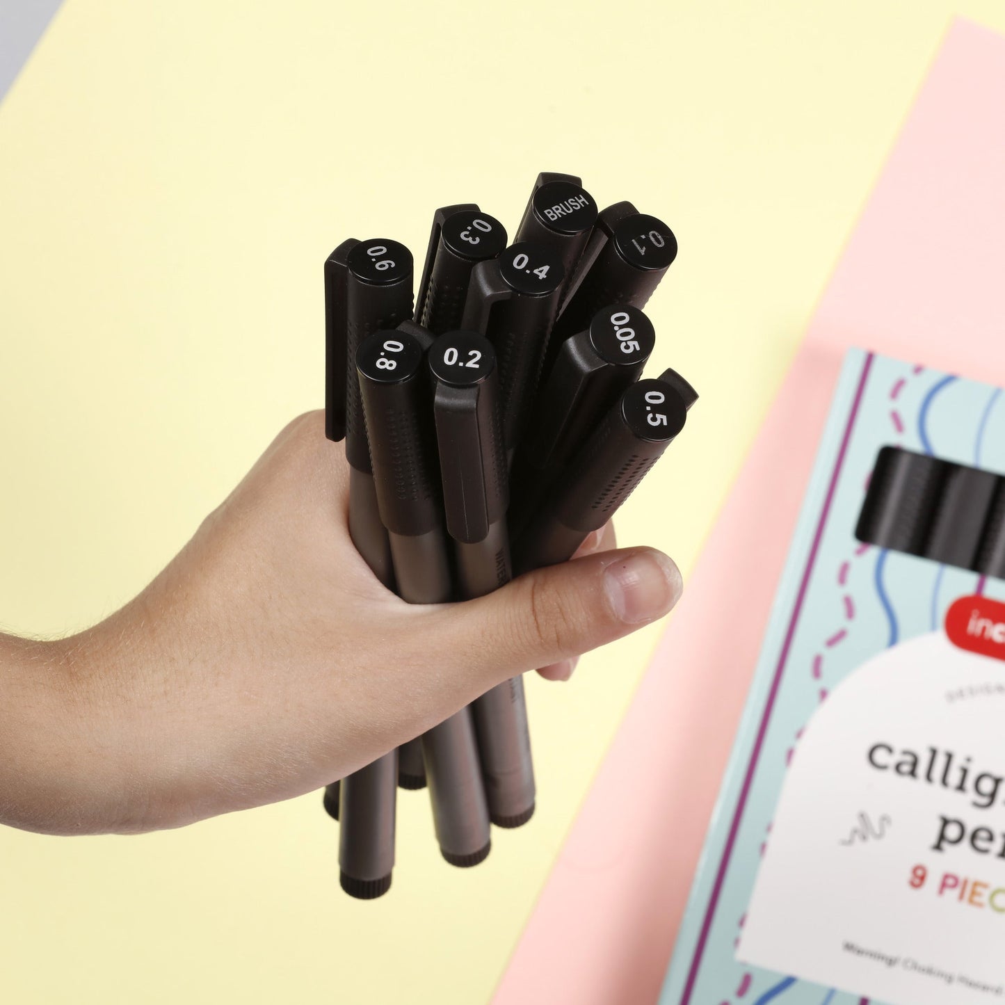 Image of Bulk Calligraphy Pens in Hand Display | Caption-Bulk Calligraphy Pens in Hand Display