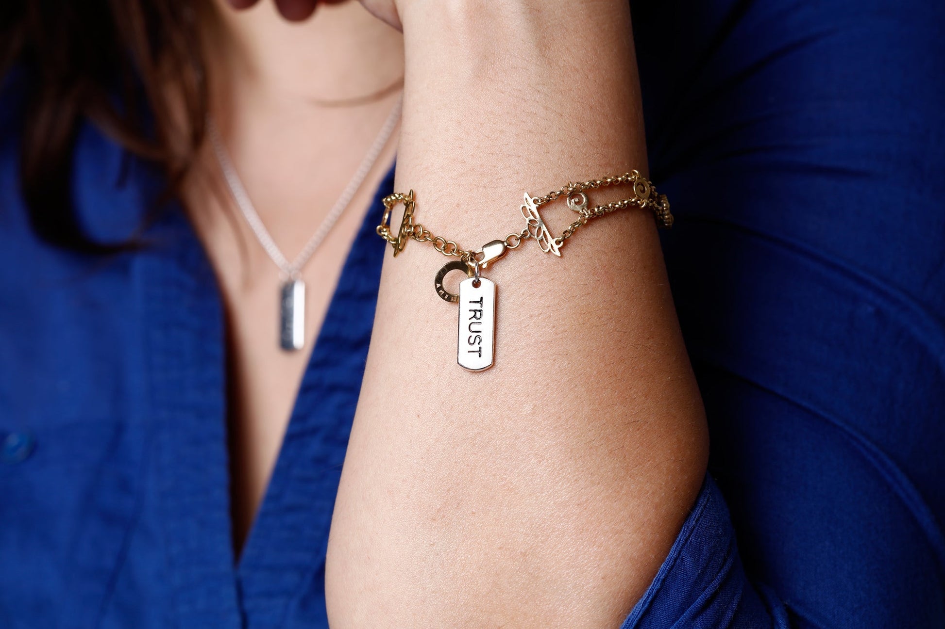 Image of Bulk Silver Word Charms Women wearing as a bracelet and necklace | Caption-Bulk Silver Word Charms Women wearing as a bracelet and necklace 