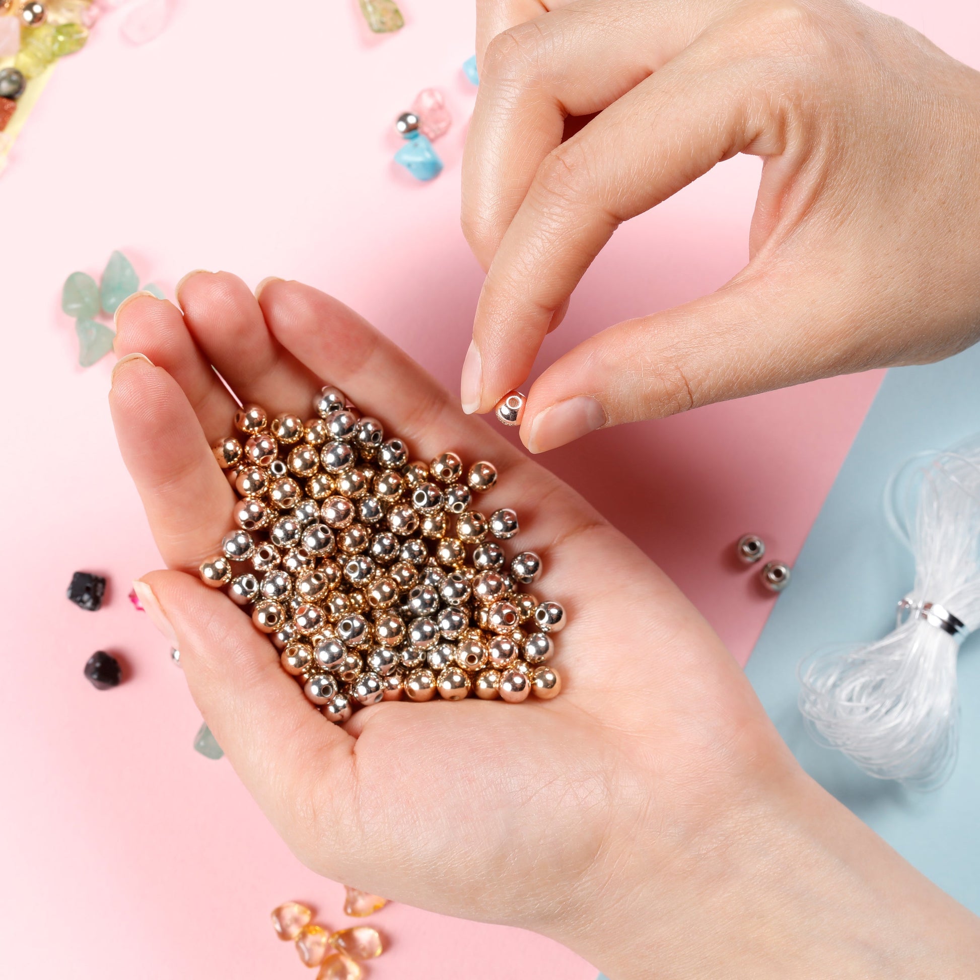 Image of Hands Holding Gemstone Beads from the Set